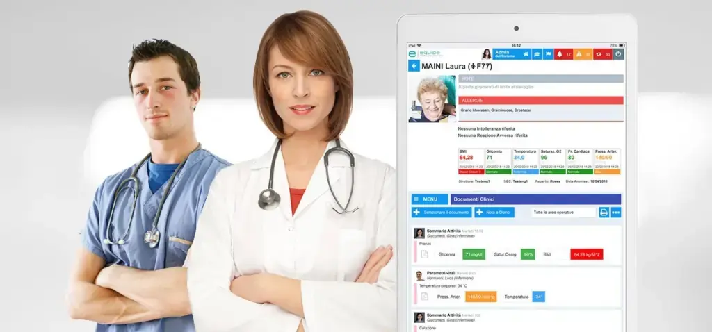 Due professionisti sanitari accanto alla schermata della cartella clinica Equipe